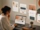 Solo entrepreneur using AI-assisted visual cards to assemble a landing page on a laptop in a warm editorial workspace