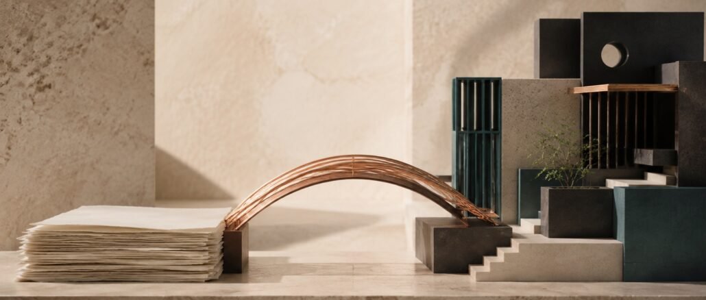A copper bridge links blank cream paper to a modular charcoal and teal structure on a warm stone surface.